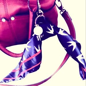 Express purse tie-on scarf with gold hardware and “Love Express” medallion.